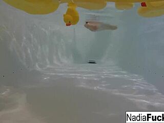 Nadia is a sexy woman who takes a relaxing bath with rubber ducks