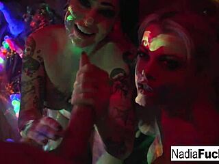 Big-boobed babes suck and lick a rainbow shaft