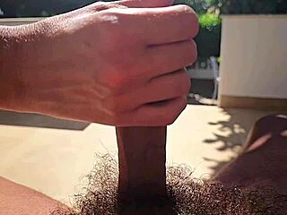 Beautiful wife gives a slow and sexy garden handjob in slow motion