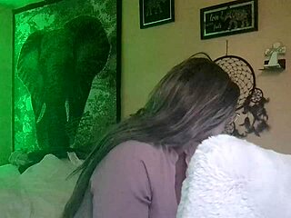 naej ae rubs her twat while watching lesbian porn