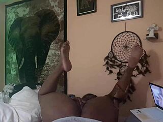 naej ae rubs her twat while watching lesbian porn