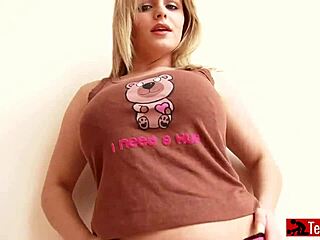 Curvy blonde displays her huge boobs on camera