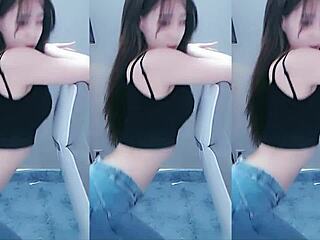 Pretty Chinese girl performs a sexy dance and shows her arousal