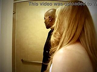 Blonde mature woman teases in the shower with natural tits