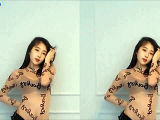 Korean cutie dances with big tits on display