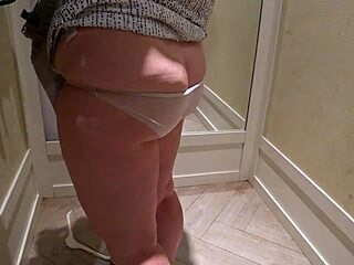 Hidden cam spies mature chubby milf trying shorts in fitting room