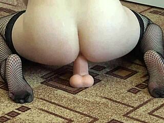 brunette in stockings fucks her juicy butt with big rubber dick