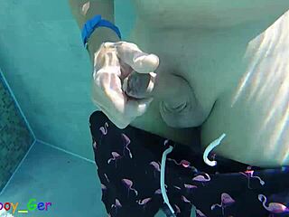 Gay guy cheekily jerks off his fat cock in a public thermal pool hot underwater fun...