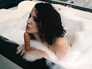 Skinny teen shoves toy deep in hairy slit till climax in motel tub!