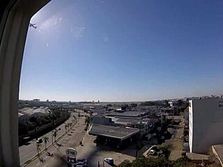 Watch Sarada naked in the hotel window overlooking the airport