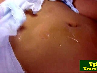 Oriental shemale masturbates in close-up solo session