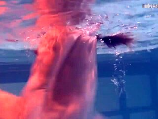 Ivetta plays seductively in pool, drawing all eyes