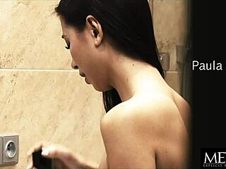 Asian babe masturbates in bathroom.