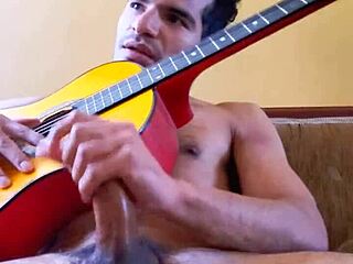 Gay Latino masturbates to guitar music