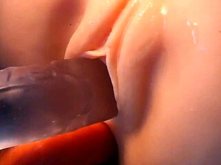 Real doll takes double penetration in both holes with toys close up