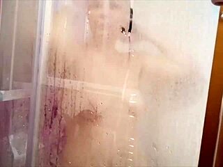 A busty milf with a great ass and hairy beaver takes a shower