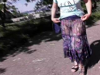 Public showing off: Mature hairy nymph in transparent dress
