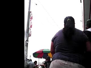 Peruvian woman excitedly does her shopping in the market