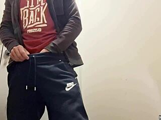 Hunky stud strokes big cock publicly