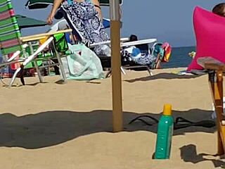 Hidden candid video of a young woman in bikini on the beach