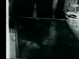 Goth lesbian explores softcore bondage in retro blue film with mirrors