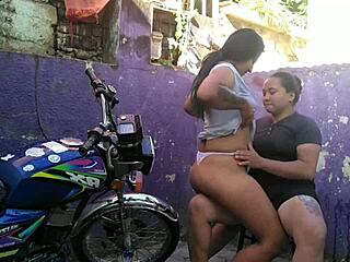 Wow! Lesbian sex at outdoor bike wash ends in creamy orgasm!