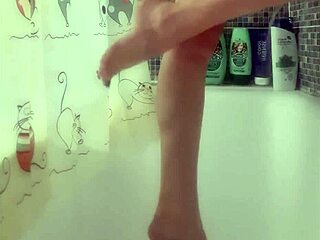 busty teen washes feet in shower