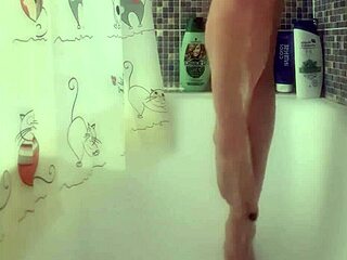 busty teen washes feet in shower