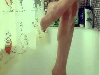 busty teen washes feet in shower