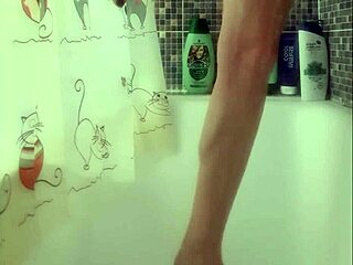 busty teen washes feet in shower