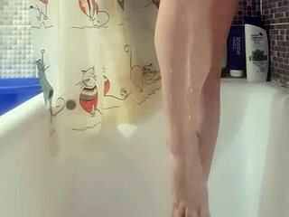 busty teen washes feet in shower