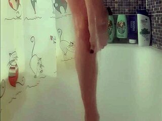 busty teen washes feet in shower