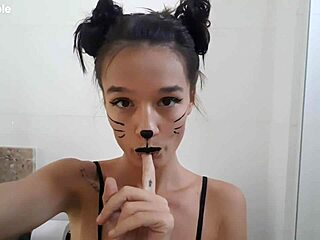 Skinny girl gets body painted in bathroom