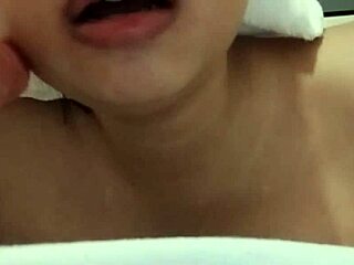 Chubby busty beauty sucks dildo