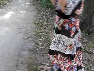 hairy mature woman flashing in the park under skirt.