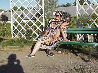 hairy mature woman flashing in the park under skirt.