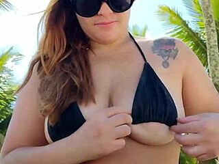 African Woman Flashes In Short Bikini At Beach