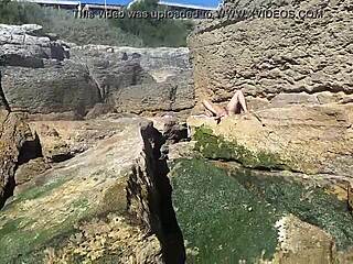 African Woman Relaxes On Nudist Beach