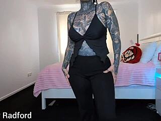 The curvy milf with big fake tits tries on outfits in the bedroom
