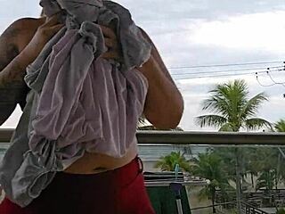Feeling excited while flashing my ass in a skirt on the balcony