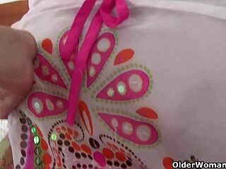 Granny with big tits gets finger fucked by photographer.