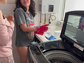 Two lesbians share a quiet moment in the kitchen.