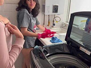 Two lesbians share a quiet moment in the kitchen.