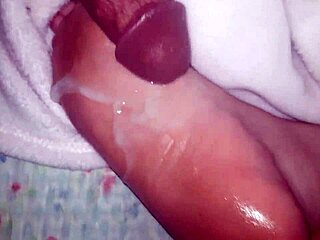 cumshot lands on oiled feet in casual scene