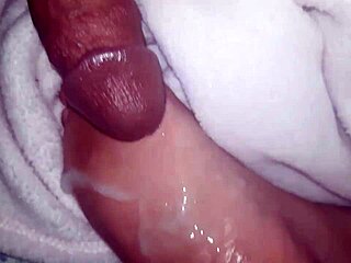 cumshot lands on oiled feet in casual scene