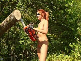 Sawing wood in a bikini in the garden.