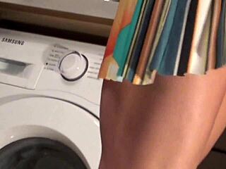 Young brunette babe strips panties under skirt in kitchen