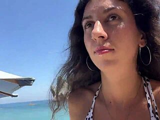 I stroll with sticky mess on my face across a crowded public beach