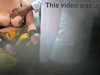 Indian doctor interacts with patient in hospital.