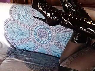 Total black outfit with fishnets pantyhose and boots over the knee!